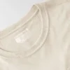 Camisas de gola redonda, corte largo e leve, com bolso, em Tencel